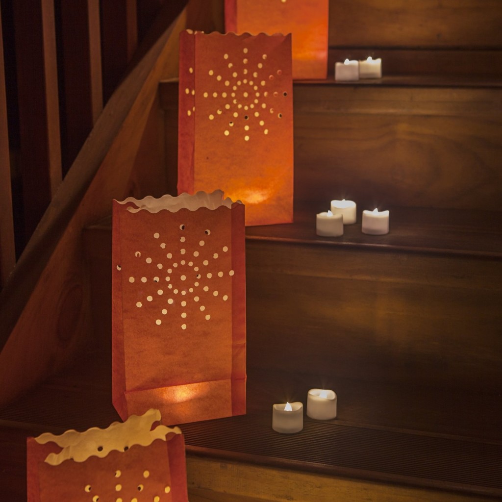 battery-operated candles in paper bags
