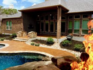 swimming pool with waterfall and fire by Water Rock, the San Antonio Pool Builder